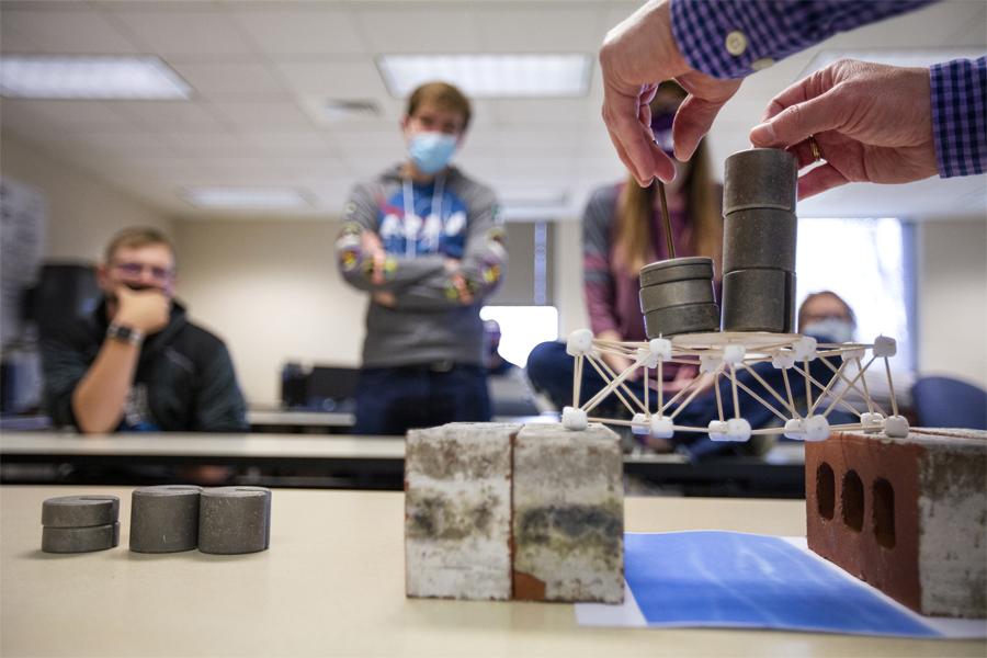 Mathematics student performing an experiment in class